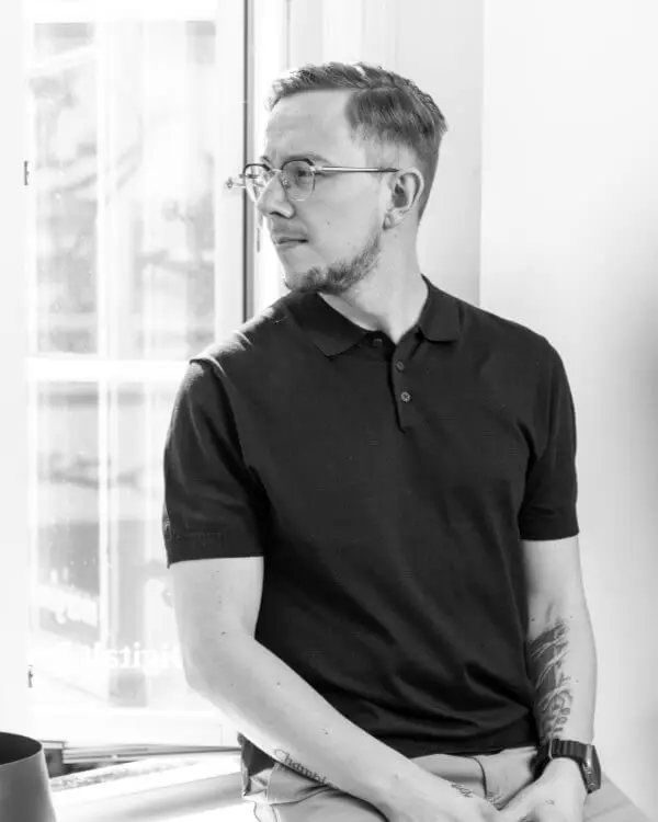 Michael Andersen sitting by a window, looking out
